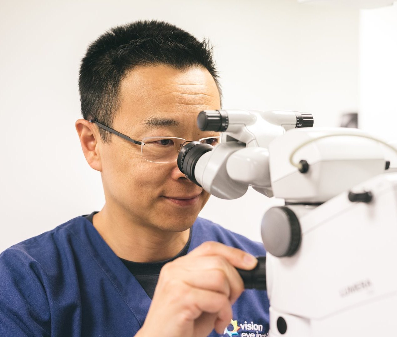 Dr Simon Chen at the surgical microscope